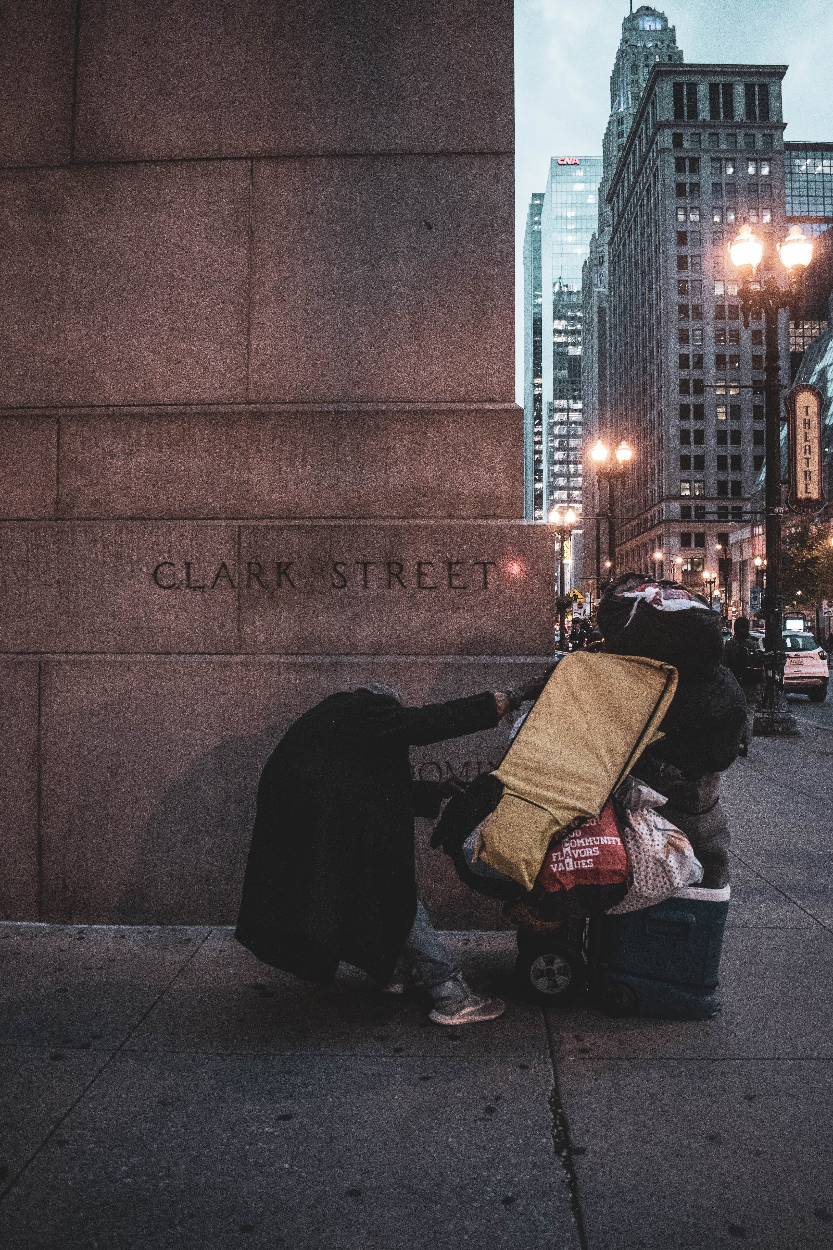 Clark Street corner in downtown Chicago with a person pushing a cart